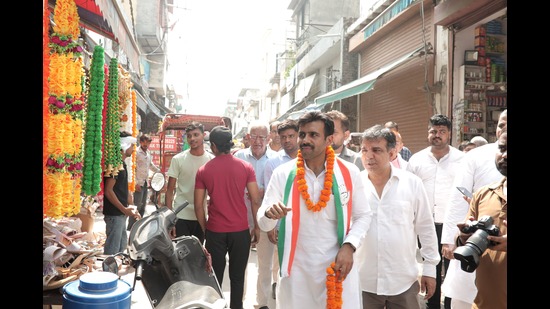 Grover during his door-to-door campaigning in Gurgaon on Tuesday. (Parveen Kumar/HT Photo) Grover during his door-to-door campaigning in Gurgaon on Tuesday. (Parveen Kumar/HT Photo)