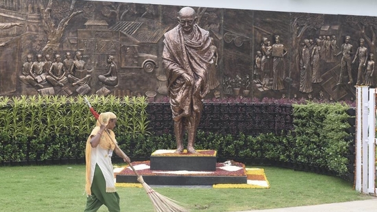 A worker sweeps an area near a statue of Mahatma Gandhi inside the Rashtriya Swachhata Kendra. (PTI) A worker sweeps an area near a statue of Mahatma Gandhi inside the Rashtriya Swachhata Kendra. (PTI)