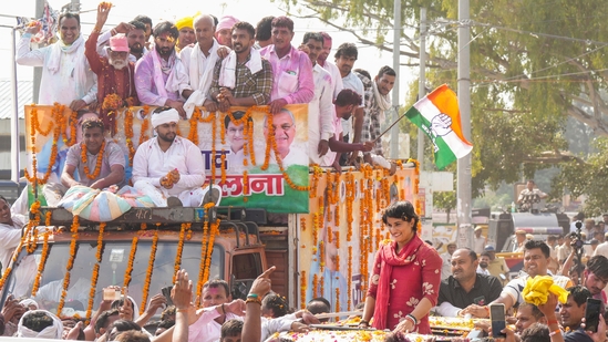 Congress candidate Vinesh Phogat greets supporters during her victory celebration after winning from Julana constituency in the Haryana Assembly elections, in Jind district, Haryana.(PTI)