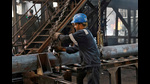 FILE PHOTO: An employee prepares to move a heavy bar of steel inside the ArcVac ForgeCast factory, in Hooghly district, in the eastern state of West Bengal, India, April 26, 2024. REUTERS/Sahiba Chawdhary/File Photo (REUTERS) FILE PHOTO: An employee prepares to move a heavy bar of steel inside the ArcVac ForgeCast factory, in Hooghly district, in the eastern state of West Bengal, India, April 26, 2024. REUTERS/Sahiba Chawdhary/File Photo (REUTERS)