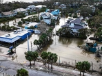 TOPSHOT - A drone image shows a flooded street due to Hurricane Milton in Siesta Key, Florida, on October 10, 2024. At least four people were confirmed killed as a result of two tornadoes triggered by Hurricane Milton on the east coast of the US state of Florida, local authorities said Thursday. (Photo by Miguel J. Rodriguez Carrillo / AFP)(AFP) TOPSHOT - A drone image shows a flooded street due to Hurricane Milton in Siesta Key, Florida, on October 10, 2024. At least four people were confirmed killed as a result of two tornadoes triggered by Hurricane Milton on the east coast of the US state of Florida, local authorities said Thursday. (Photo by Miguel J. Rodriguez Carrillo / AFP)(AFP)