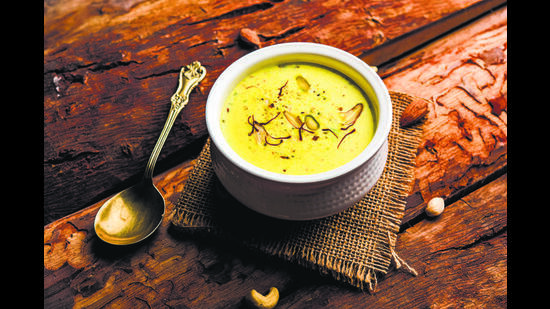 A serving of rabri, topped with saffron strands. It takes about 1.5 lakh flowers to produce 1 kg of dried saffron. (Adobe Stock) A serving of rabri, topped with saffron strands. It takes about 1.5 lakh flowers to produce 1 kg of dried saffron. (Adobe Stock)