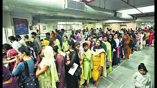 Long queues of patients waiting outside the registration counter of the gynaecology department of the Postgraduate Institute of Medical Education and Research, Chandigarh, on Monday. (HT Photo) Long queues of patients waiting outside the registration counter of the gynaecology department of the Postgraduate Institute of Medical Education and Research, Chandigarh, on Monday. (HT Photo)