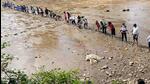 Locals during a drive to rescue fish from the drying Dal Lake in Dharamshala. (File) Locals during a drive to rescue fish from the drying Dal Lake in Dharamshala. (File)