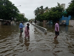 People wade through a flooded street after heavy rains in Chennai, India, Wednesday, Oct. 16, 2024. (AP Photo/Mahesh Kumar A.)(AP) People wade through a flooded street after heavy rains in Chennai, India, Wednesday, Oct. 16, 2024. (AP Photo/Mahesh Kumar A.)(AP)