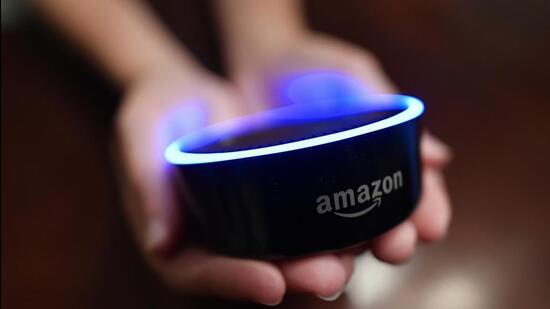 A child holds an Amazon Echo Dot. (AP File Photo) A child holds an Amazon Echo Dot. (AP File Photo)
