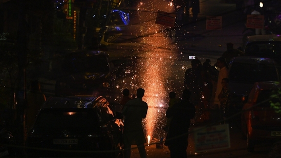 People burst crackers on the occasion of Diwali at Pandav Nagar in New Delhi on October 31. The city's air quality dropped to the "very poor" category, with an Air Quality Index (AQI) of 330 at 10 pm.(Ajay Aggarwal/ Hindustan Times)