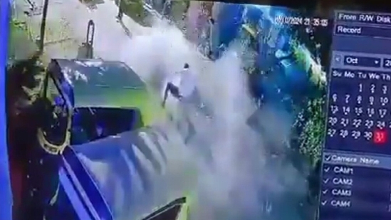 . It is said to be part of a game among his friends where one who sits on the cracker box would get a new auto rickshaw. (Screengrab from viral video) . It is said to be part of a game among his friends where one who sits on the cracker box would get a new auto rickshaw. (Screengrab from viral video)
