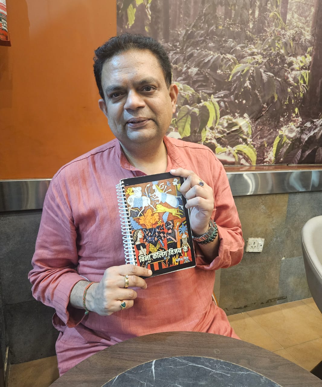 Yatindra Mishra with his upcoming poetry book Bina Kalinga Vijay Ke(Deep Saxena/HT) Yatindra Mishra with his upcoming poetry book Bina Kalinga Vijay Ke(Deep Saxena/HT)