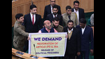 Langate MLA Khurshid Ahmad Sheikh displaying the banner in support of the resolution to restore the Jammu and Kashmir's special status during the ongoing assembly session in Srinagar. (Waseem Andrabi/HT) Langate MLA Khurshid Ahmad Sheikh displaying the banner in support of the resolution to restore the Jammu and Kashmir's special status during the ongoing assembly session in Srinagar. (Waseem Andrabi/HT)