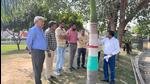 Local environmentalists gather around the trees that are set to be either felled or transplanted from Gaur Chowk. (HT Photo) Local environmentalists gather around the trees that are set to be either felled or transplanted from Gaur Chowk. (HT Photo)