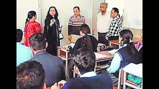 The Chandigarh Commission for Protection of Child Rights team during the raid at Stepping Stones Senior Secondary School in Sector 37. (HT Photo) The Chandigarh Commission for Protection of Child Rights team during the raid at Stepping Stones Senior Secondary School in Sector 37. (HT Photo)