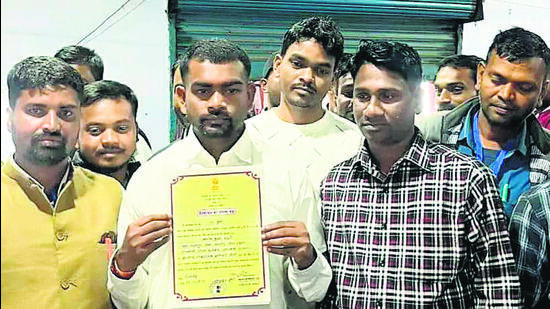 Jairam Mahato holds the victory certificate on Saturday. (HT Photo) Jairam Mahato holds the victory certificate on Saturday. (HT Photo)