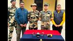 The BSF with one of the seized drones and the packet of heroin. (HT File) The BSF with one of the seized drones and the packet of heroin. (HT File)
