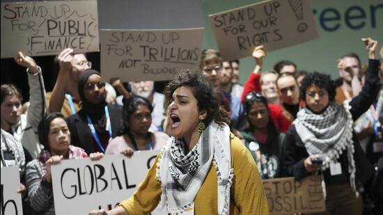 Activists demonstrate over climate finance at the COP29 summit in Baku, Azerbaijan, on Saturday. (AP Photo) Activists demonstrate over climate finance at the COP29 summit in Baku, Azerbaijan, on Saturday. (AP Photo)