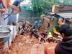 Rescue personnel remove debris after a landslide triggered by heavy rain in Tiruvannamalai on Monday. (AFP) Rescue personnel remove debris after a landslide triggered by heavy rain in Tiruvannamalai on Monday. (AFP)