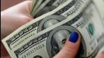 A woman counts US dollar bills. (Reuters Photo) A woman counts US dollar bills. (Reuters Photo)