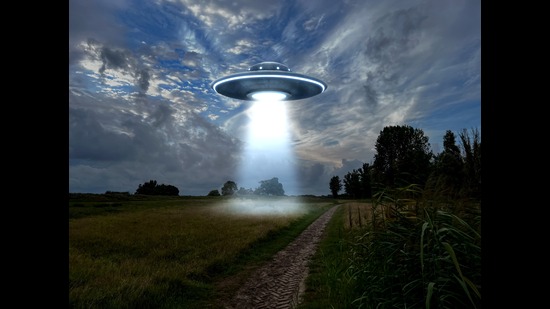 A speculative image of a UFO hovering over the earth. (Shutterstock) A speculative image of a UFO hovering over the earth. (Shutterstock)