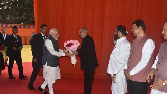 The oath was administered by governor CP Radhakrishnan, with Prime Minister Narendra Modi, union home minister Amit Shah and defence minister Rajnath Singh present as well.(Yogesh Naik/ Hindustan Times)