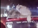Bengaluru man was seen putting his pet dogs on top of his red-coloured car without any harness or tether. Bengaluru man was seen putting his pet dogs on top of his red-coloured car without any harness or tether.