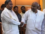 Former Prime Minister of India and Janata Dal (Secular) president H D Devegowda shakes hand with the Karnataka chief minister of Karnataka and Congress leader Siddaramaiah . File Photo Former Prime Minister of India and Janata Dal (Secular) president H D Devegowda shakes hand with the Karnataka chief minister of Karnataka and Congress leader Siddaramaiah . File Photo