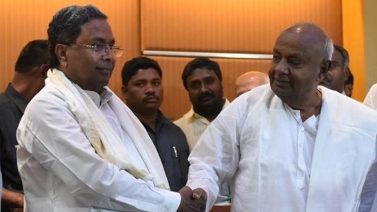 Former Prime Minister of India and Janata Dal (Secular) president H D Devegowda shakes hand with the Karnataka chief minister of Karnataka and Congress leader Siddaramaiah . File Photo Former Prime Minister of India and Janata Dal (Secular) president H D Devegowda shakes hand with the Karnataka chief minister of Karnataka and Congress leader Siddaramaiah . File Photo