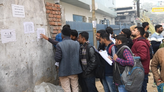 Aspirants checking their names on list to appear for RRB RPF SI exam at ION Digital zone in Patna. (Santosh Kumar )