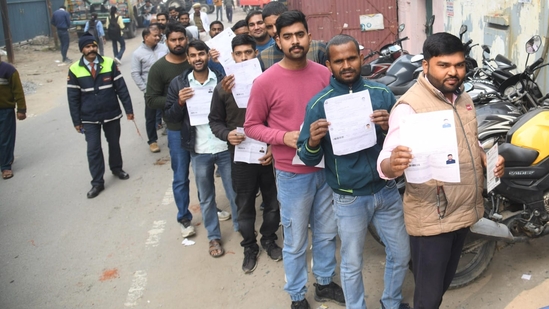 Applicants waiting in a queue before entering appearing for the Railway Recruitment Board exam at ION Digital zone in Patna. (Santosh Kumar )