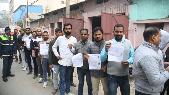 Applicants with their admit card standing at queue at ION Digital zone in Patna. (Santosh Kumar )