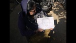 Sagar’s mother Rani Sharma showing a sketch of her son. (HT) Sagar’s mother Rani Sharma showing a sketch of her son. (HT)