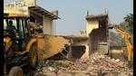 The Gurugram Metropolitan Development Authority (GMDA) on Tuesday demolished 10 illegal but permanent structures along the Southern Peripheral Road at Ram Bir ki Dhani in Gurugram. (HT PHOTO) The Gurugram Metropolitan Development Authority (GMDA) on Tuesday demolished 10 illegal but permanent structures along the Southern Peripheral Road at Ram Bir ki Dhani in Gurugram. (HT PHOTO)