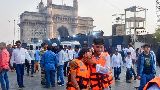 Passengers after being rescued in a joint operation by the Indian Navy and Indian Coast Guard after a ferry capsized off Mumbai coast.(PTI)