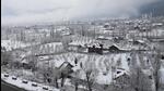 Houses covered in snow after the plains of Kashmir received the season's first snowfall after a long dry spell on December 12. (PTI Photo) Houses covered in snow after the plains of Kashmir received the season's first snowfall after a long dry spell on December 12. (PTI Photo)