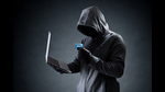 Computer hacker with credit card stealing data from a laptop concept for network security, identity theft and computer crime (HT Archive) Computer hacker with credit card stealing data from a laptop concept for network security, identity theft and computer crime (HT Archive)