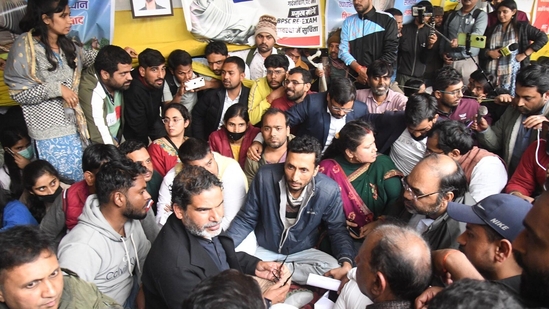 Jan Suraaj Party chief Prashant Kishor meets the protestors demanding the cancellation of BPSC 70th Integrated Combined Competitive Examination (CCE) over the alleged paper leak at Gardanibagh in Patna(Santosh Kumar)