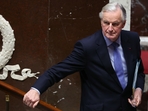 French Prime Minister Michel Barnier leaves after delivering a speech during the debate prior to the no-confidence votes on his administration at the National Assembly in Paris on December 4, 2024. (Photo by Alain JOCARD / AFP) (AFP) French Prime Minister Michel Barnier leaves after delivering a speech during the debate prior to the no-confidence votes on his administration at the National Assembly in Paris on December 4, 2024. (Photo by Alain JOCARD / AFP) (AFP)