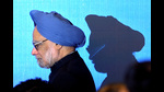 FILE PHOTO: India's Prime Minister Manmohan Singh walks on stage for a photo opportunity as part of the 5th East Asia Summit in Hanoi, Vietnam, October 30, 2010. REUTERS/Christophe Archambault/Pool)/File Photo (REUTERS) FILE PHOTO: India's Prime Minister Manmohan Singh walks on stage for a photo opportunity as part of the 5th East Asia Summit in Hanoi, Vietnam, October 30, 2010. REUTERS/Christophe Archambault/Pool)/File Photo (REUTERS)