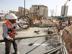 In the town of Beer Yaakov in central Israel, Raju Nishad manoeuvres around scaffolding while pounding bricks that will make up a structure in a new community.
(AFP) In the town of Beer Yaakov in central Israel, Raju Nishad manoeuvres around scaffolding while pounding bricks that will make up a structure in a new community.
(AFP)