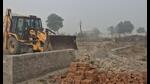 The operation, which went on for three hours on Saturday, was carried out under the supervision of senior officials of GNIDA, supported by security personnel, using three JCB machines and two dump-trucks. (HT PHOTO) The operation, which went on for three hours on Saturday, was carried out under the supervision of senior officials of GNIDA, supported by security personnel, using three JCB machines and two dump-trucks. (HT PHOTO)