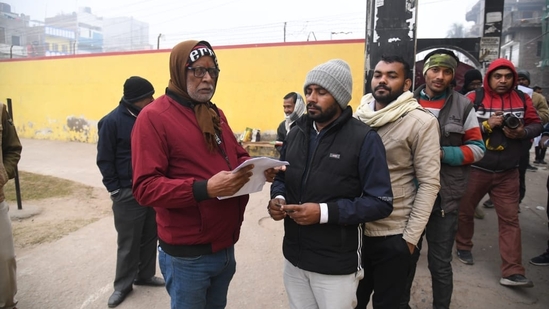 Bihar Public Service Commission (BPSC) 70th Prelims Re-Exam today. Candidates waiting outside exam centre at Mahath Hanuman Sharn high School, in Patna. (Santosh Kumar )