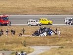 Rescue work underway after a Indian Coast Guard (ICG) helicopter crashed during landing at Porbandar airport in Gujarat on Sunday. (PTI) Rescue work underway after a Indian Coast Guard (ICG) helicopter crashed during landing at Porbandar airport in Gujarat on Sunday. (PTI)