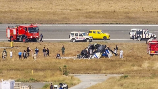Rescue work underway after a Indian Coast Guard (ICG) helicopter crashed during landing at Porbandar airport in Gujarat on Sunday. (PTI) Rescue work underway after a Indian Coast Guard (ICG) helicopter crashed during landing at Porbandar airport in Gujarat on Sunday. (PTI)