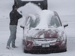 A person dusts snow off of a car during a winter storm, Sunday, Jan. 5, 2025, in Cincinnati. About 63 million people in the central and southern US are on alert for a 'heaviest' possible winterstorm.(AP) A person dusts snow off of a car during a winter storm, Sunday, Jan. 5, 2025, in Cincinnati. About 63 million people in the central and southern US are on alert for a 'heaviest' possible winterstorm.(AP)