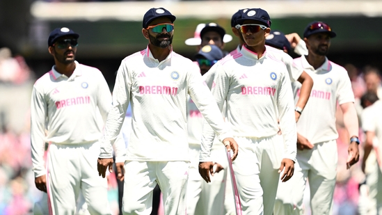 Members of the Indian team walk off the SCG pitch after being beaten by Australia.(AAP Image via REUTERS)