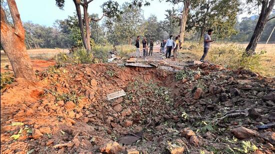 Visuals from the spot showed a huge crater, more than 14-feet deep, splitting the narrow road near a culvert at the site. (HT Photo) Visuals from the spot showed a huge crater, more than 14-feet deep, splitting the narrow road near a culvert at the site. (HT Photo)