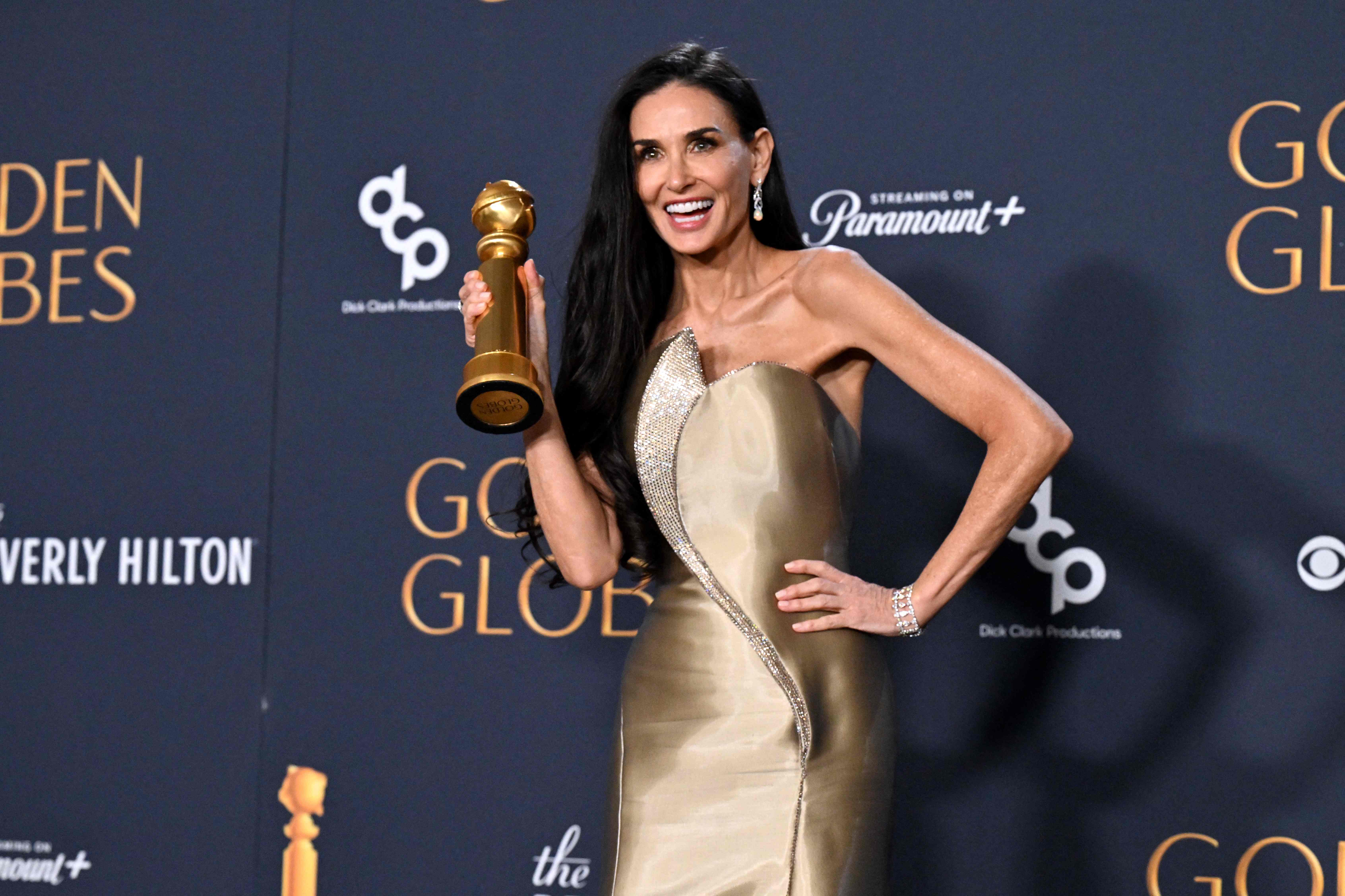 TOPSHOT - US actress Demi Moore poses with the Best Performance by a Female Actor in a Motion Picture � Musical or Comedy award for "The Substance" in the press room during the 82nd annual Golden Globe Awards at the Beverly Hilton hotel in Beverly Hills, California, on January 5, 2025. (Photo by Robyn Beck / AFP)(AFP) TOPSHOT - US actress Demi Moore poses with the Best Performance by a Female Actor in a Motion Picture � Musical or Comedy award for "The Substance" in the press room during the 82nd annual Golden Globe Awards at the Beverly Hilton hotel in Beverly Hills, California, on January 5, 2025. (Photo by Robyn Beck / AFP)(AFP)