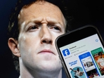This photo illustration created on January 7, 2025, in Washington, DC, shows an image of Mark Zuckerberg, CEO of Meta, and a phone displaying the download page for the Facebook app. Social media giant Meta on January 7, 2025, slashed its content moderation policies, including ending its US fact-checking program, in a major shift that conforms with the priorities of incoming president Donald Trump. (Drew Angerer/AFP) This photo illustration created on January 7, 2025, in Washington, DC, shows an image of Mark Zuckerberg, CEO of Meta, and a phone displaying the download page for the Facebook app. Social media giant Meta on January 7, 2025, slashed its content moderation policies, including ending its US fact-checking program, in a major shift that conforms with the priorities of incoming president Donald Trump. (Drew Angerer/AFP)