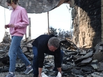 Pacific Palisades Fire: Rev. John Shaver carries away a section of the baptismal font after looking through the remains of Community United Methodist Church, while visiting for the first time since it was destroyed in the Palisades Fire, as wildfires cause damage and loss through Los Angeles County on January 10, 2025 in Pacific Palisades, California.(Mario Tama/Getty Images/AFP) Pacific Palisades Fire: Rev. John Shaver carries away a section of the baptismal font after looking through the remains of Community United Methodist Church, while visiting for the first time since it was destroyed in the Palisades Fire, as wildfires cause damage and loss through Los Angeles County on January 10, 2025 in Pacific Palisades, California.(Mario Tama/Getty Images/AFP)