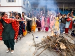 Patna: Students and teachers dance as they celebrate Lohri and Makar Sankranti, at J.D. Women's College, in Patna, Monday, Jan. 13, 2025. (PTI Photo)(PTI01_13_2025_000252B)(PTI) Patna: Students and teachers dance as they celebrate Lohri and Makar Sankranti, at J.D. Women's College, in Patna, Monday, Jan. 13, 2025. (PTI Photo)(PTI01_13_2025_000252B)(PTI)