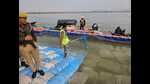 A Ganga sevadoot at a ghat near Sangam on Monday (HT Photo) A Ganga sevadoot at a ghat near Sangam on Monday (HT Photo)